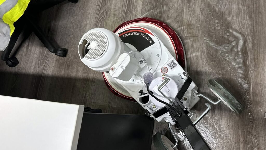 Rotary floor machine cleaning office vinyl flooring, Toowoomba